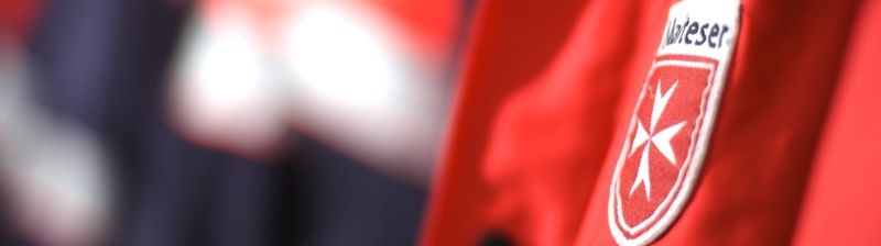 Malteser Logo auf rotem Hintergrund